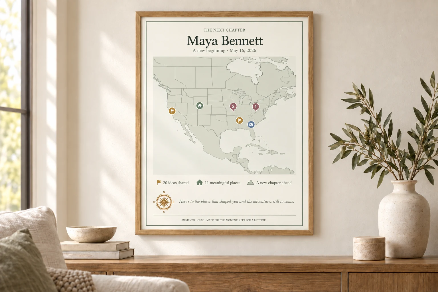 A framed Next Chapter map displayed in a warm new home or study